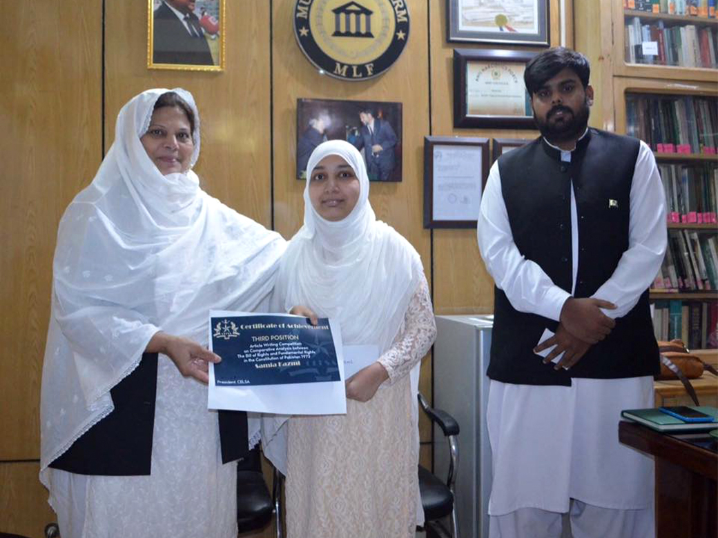 Miss. Samia Kazmi receiving third prize from Mrs. Ummi-Farhat, Co-Chairperson, MLF. Facilitated by Mr. Israr Ahmed Durrani.